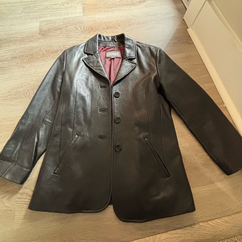 Vintage black leather Wilson jacket with wine colored interior lining